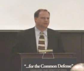 Cord Sterling, a lobbyist for a group representing defense contractors like Boeing and Lockheed Martin, speaks at a Tea Party-style event against cuts to wasteful defense spending.