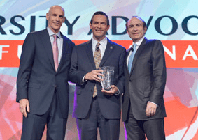 Comcast chief executive Neil Smit (left) and Brent Wilkes (center). Smit has been tapped to lead the merger between Comcast and Time Warner Cable.